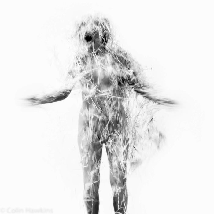 Woman screaming covered in paper strips from the Fine Art Photography series by Three Collaborate