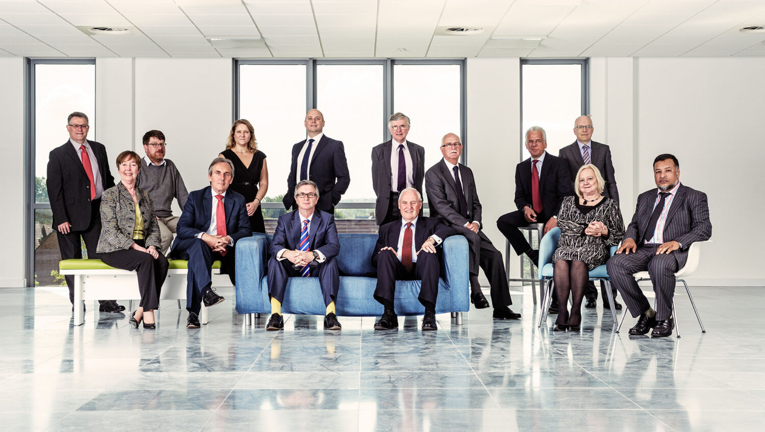 Group of CEO's and business managers on location in empty office building by photographer Colin Hawkins